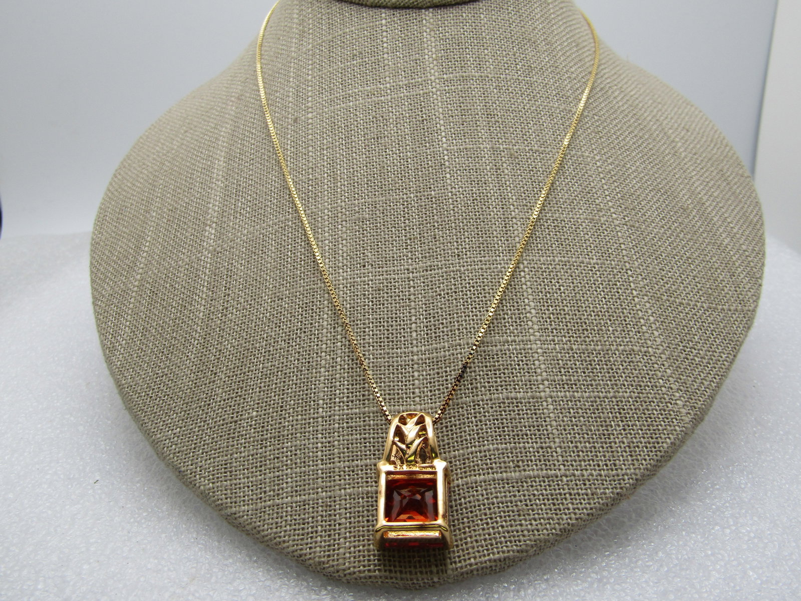 Sterling Vermeil Orange & Clear CZ Pendant, Technibond, Original Box, 18": Sterling Vermeil Orange & Clear CZ Pendant, Technibond, Original Box, 18". This has a nearly 1" long pendant with a decorative wide bail, three clear CZ stones and a square 12mm orange faceted CZ or