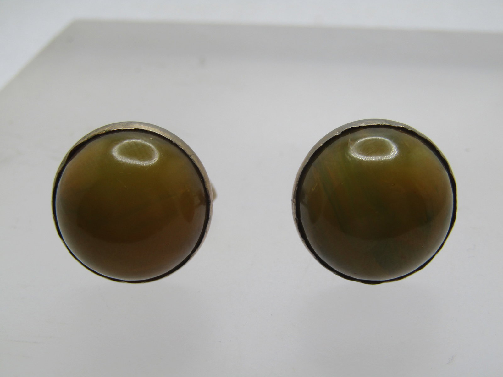 Vintage Green/Yellow Bakelite Cufflinks, Signed Swank, 1940's-1950's: Vintage 10kt G.F. Green/Yellow Bakelite Cufflinks, Signed Swank, 1940's-1950's. End-of-day in green and yellow bakelite - appx. 16mm round cabochons, bezel-set in 10kt gold filled settings. Signed Swa