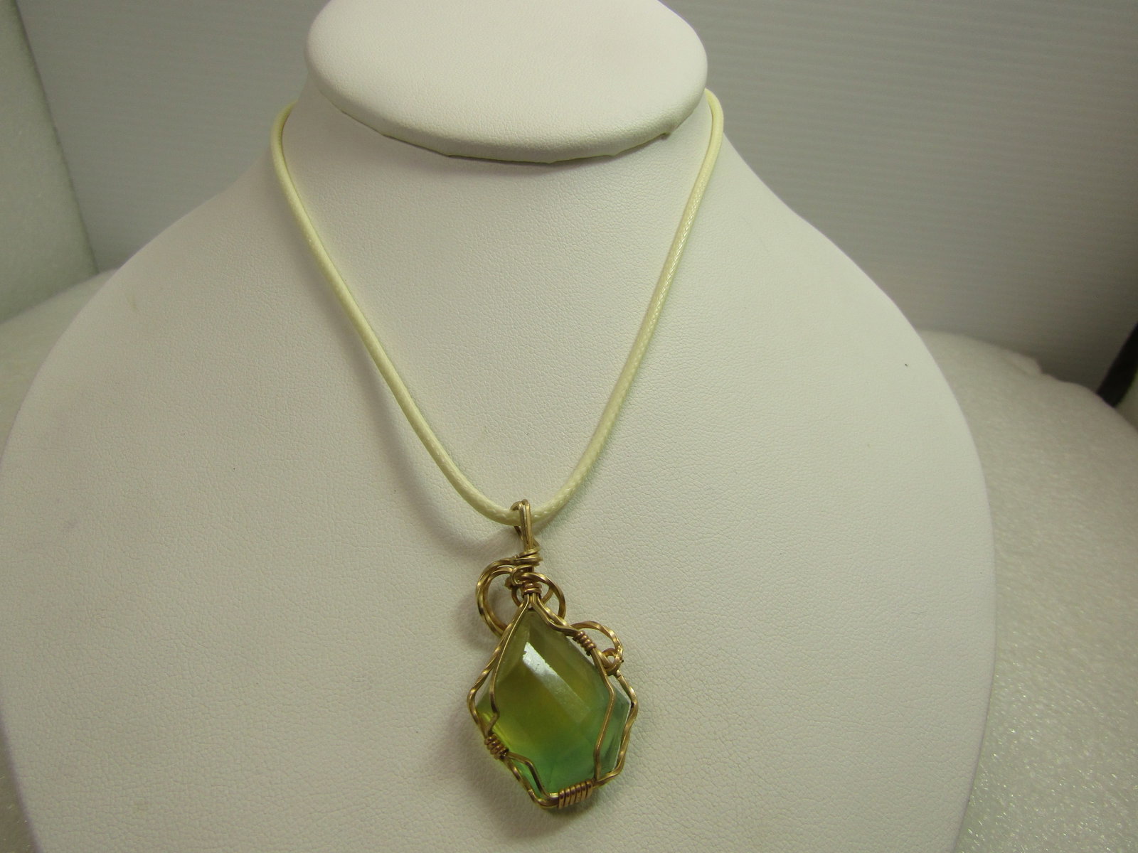10Kt G.F. Wrapped Green/Yellow Natural Stone, Necklace, 18"-20", 1980's-1990's: 10Kt G.F. Wrapped Green/Yellow Natural Stone, Necklace, 18"-20". This has a yellow/green natural stone pendant that is wrapped in quare 10kt G.F. wire. Likely made by a person that makes jewelry as op