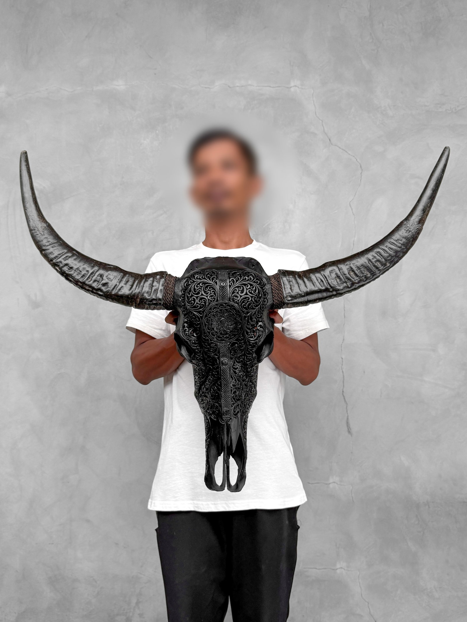 Black carved water buffalo skull - Double flower mandala motif: Title: Black carved water buffalo skull - Double flower mandala motif Maker:Unknown Origin: Indonesia Date/Period:2026 Materials:Bubalus Bubalis, bone, horn Dimensions:Height: 73 cm / 28.7 inches. Len