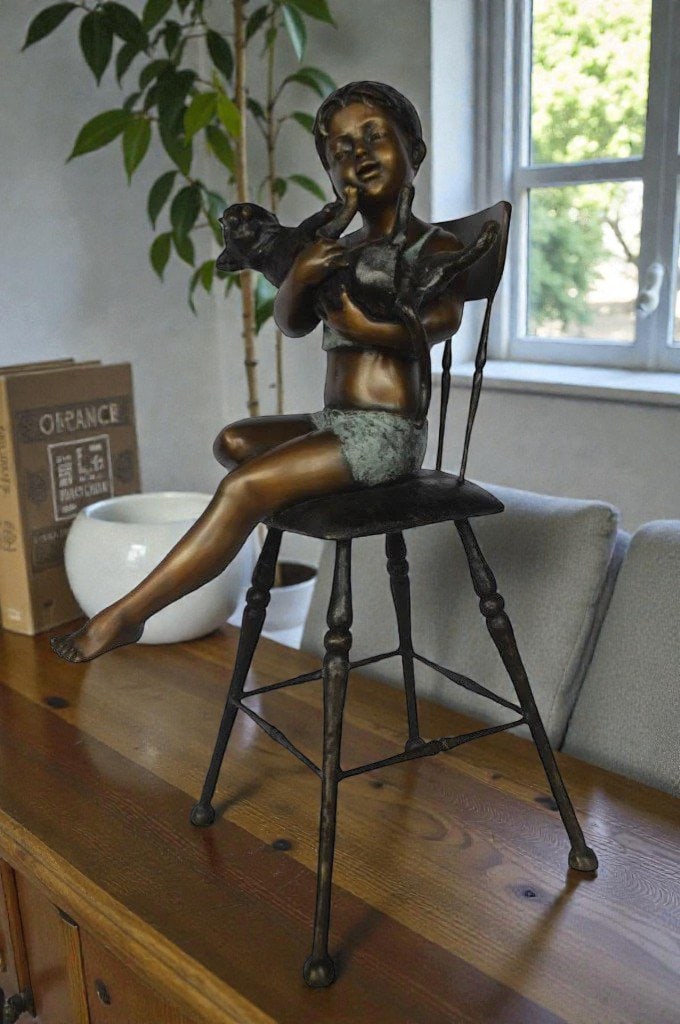 Girl with a cat on a high chair bronze statue - Size: 16"L x 16"W x 38"H. - 2
