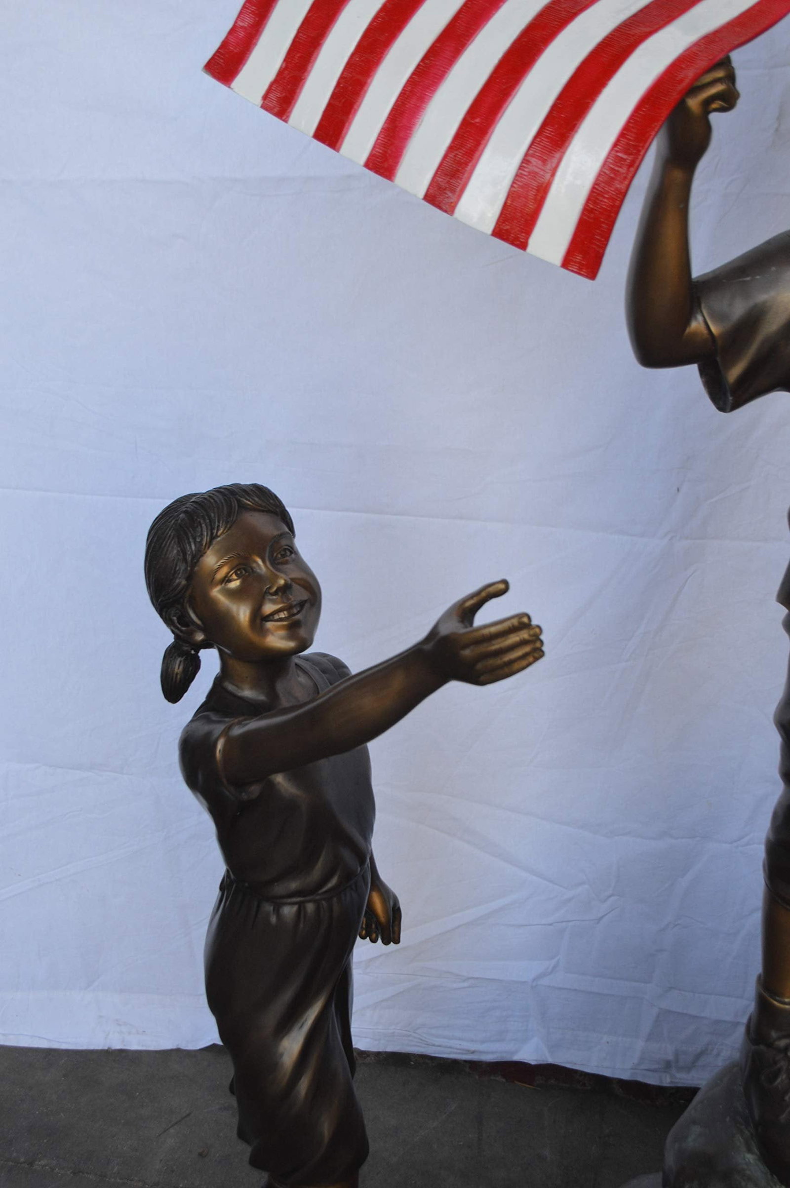 Two Kids on Rock W the American Flag Bronze Statue - Size: 50"L x 22"W x 58"H. - 7