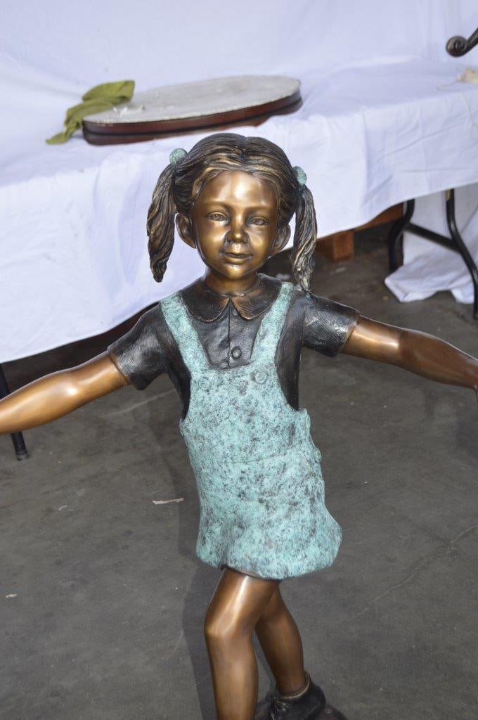 Three children happily holding hands bronze statue - Size: 31"L x 19"W x 41"H. - 2