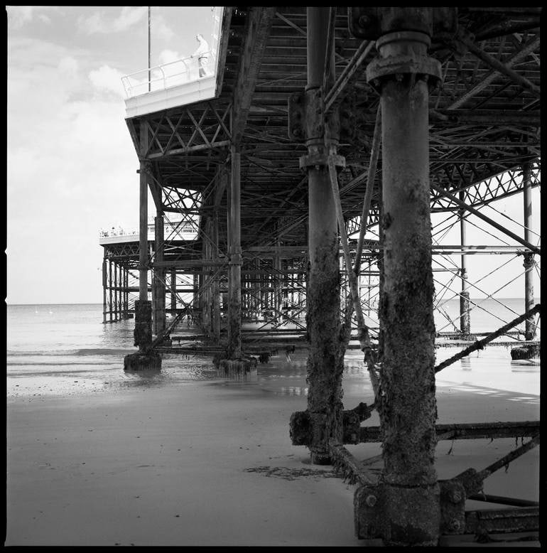 Man On Pier, Cromer, North Norfolk - Silver Gelatin Photograph: Title: Man On Pier, Cromer, North Norfolk - Silver Gelatin Photograph Description: 16 x 20 in Medium: Man on Pier, Cromer, North Norfolk - Silver Gelatin Photograph - Limited Edition of 10 Paul Cookli