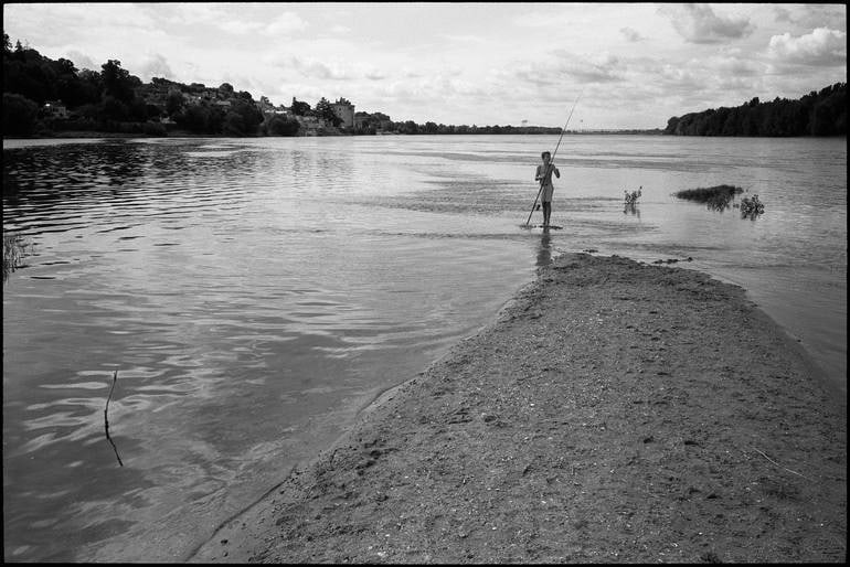 Edition 2/10 - Boy Fishing, Candes Saint Martin, France Photograph: Title: Edition 2/10 - Boy Fishing, Candes Saint Martin, France Photograph Description: 20 x 16 in Medium: Edition 2/10 - Boy Fishing, Candes Saint Martin, France Photograph Paul Cooklin United Kingdom