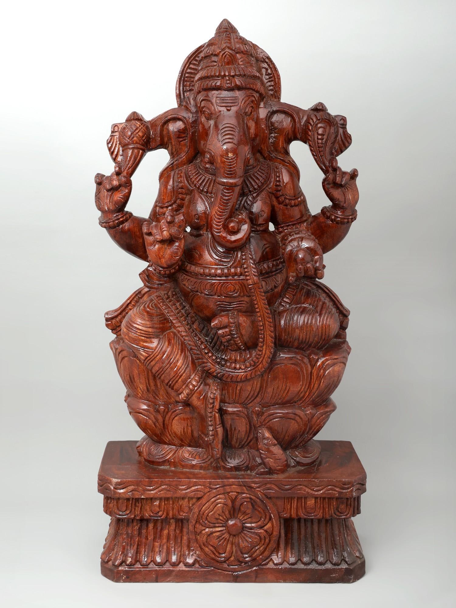 36" Large Four Armed Lord Ganesha Seated on Lotus / Wood Carving: Title: 36" Large Four Armed Lord Ganesha Seated on Lotus / Wood Carving Description: Additional Information: itemcode: DDO731 Reserve: $647.00 Shipping: Domestic: Shipping rates are determined by