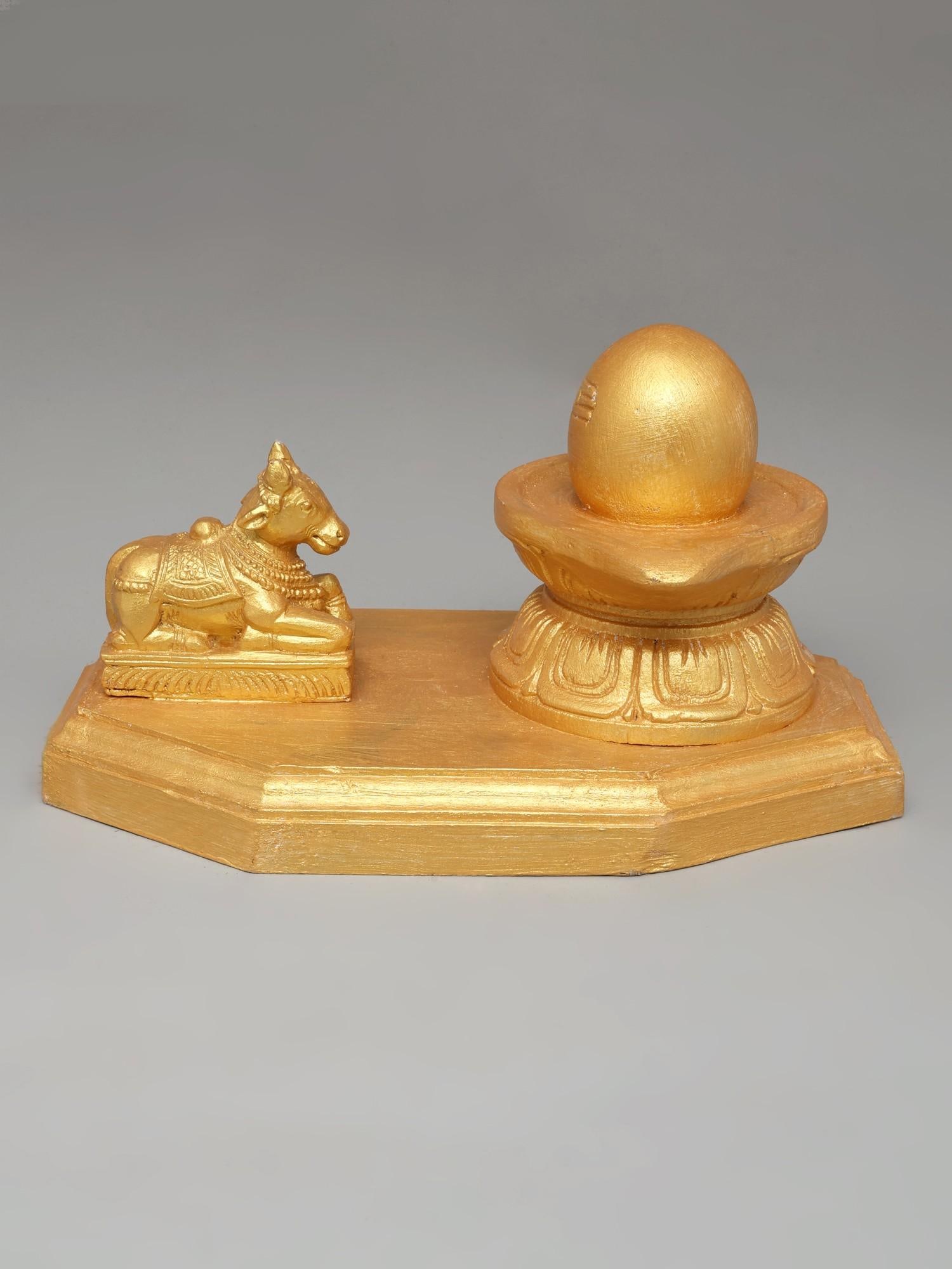 10" Golden Colored Nandi Shivalinga in Wood: Title: 10" Golden Colored Nandi Shivalinga in Wood Description: Additional Information: itemcode: DDO734 Reserve: $150.00 Shipping: Domestic: Shipping rates are determined by destination