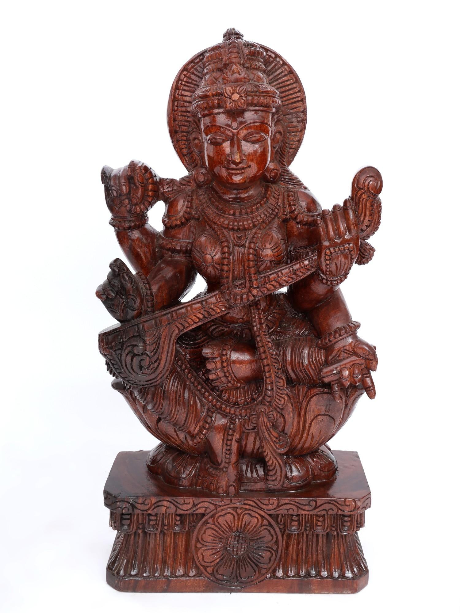 36" Large Devi Saraswati Seated on Lotus / Wood Carving: Title: 36" Large Devi Saraswati Seated on Lotus / Wood Carving Description: Additional Information: itemcode: DDO758 Reserve: $751.00 Shipping: Domestic: Shipping rates are determined by destination