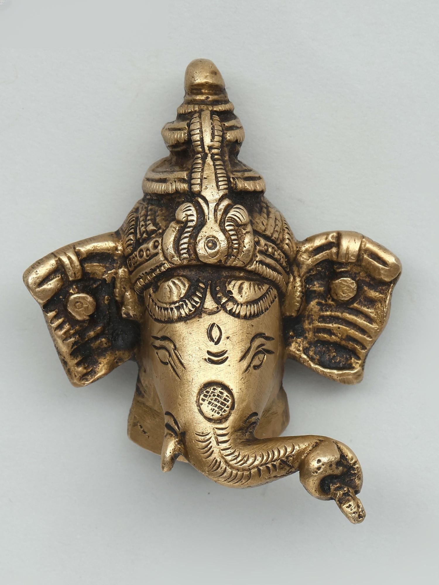 3" Small Lord Ganesha Face Wall Hanging Statue in Brass: Title: 3" Small Lord Ganesha Face Wall Hanging Statue in Brass Description: Additional Information: itemcode: DDO916 Reserve: $32.00 Shipping: Domestic: Shipping rates are determined by destination In