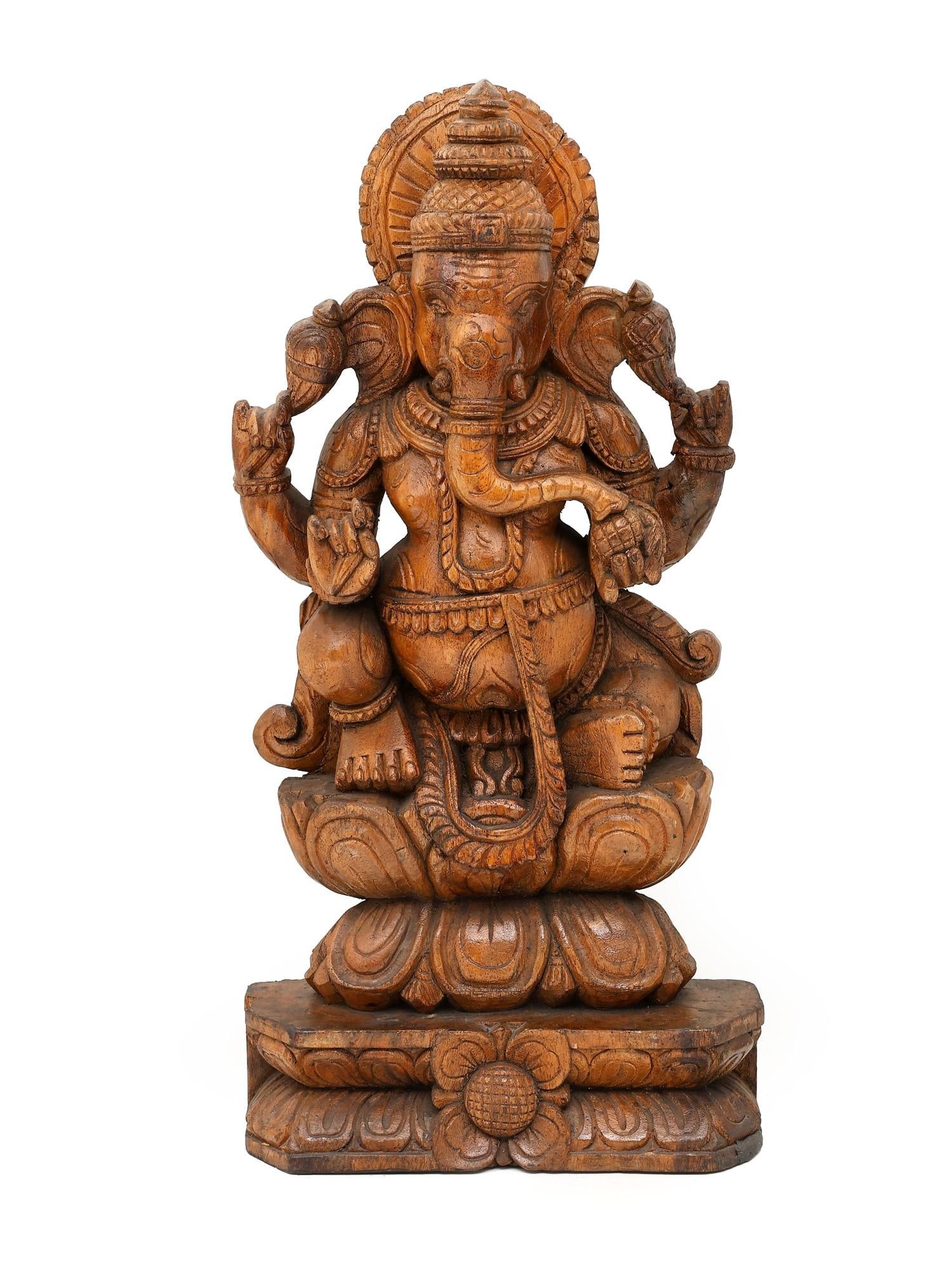 24" Chaturbhuja Lord Ganesha Seated on Lotus / Wood Carving: Title: 24" Chaturbhuja Lord Ganesha Seated on Lotus / Wood Carving Description: Additional Information: itemcode: DDP330 Reserve: $367.00 Shipping: Domestic: Shipping rates are determined by destinati