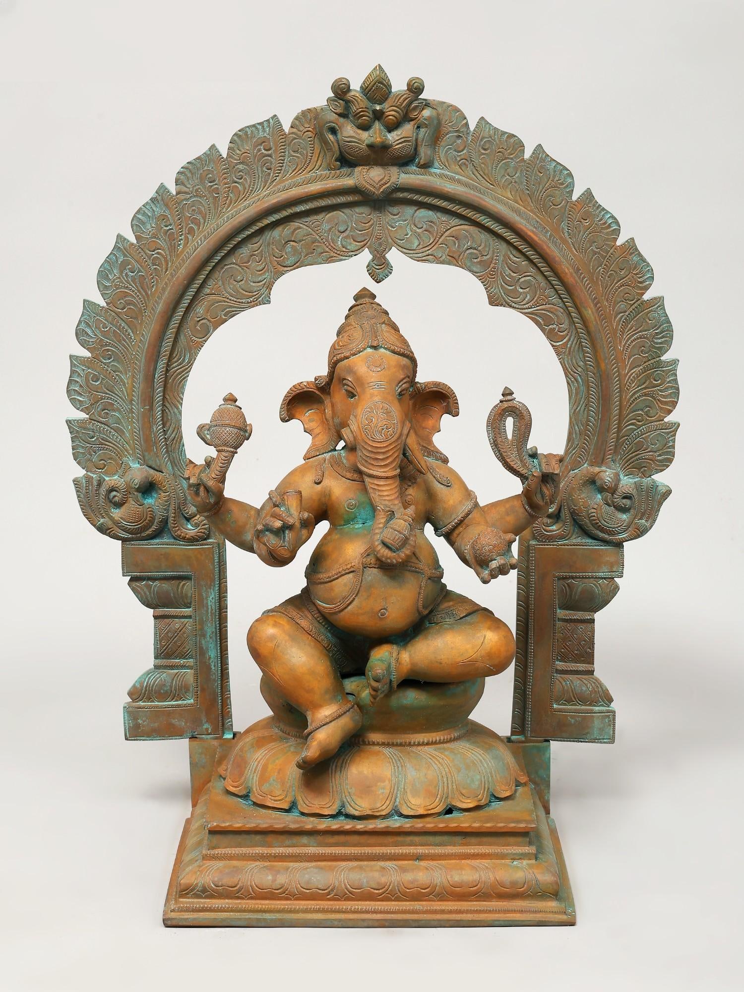 17" Four Armed Lord Ganesha Seated on Kirtimukha Throne / Madhuchista Vidhana (Lost-Wax) /: Title: 17" Four Armed Lord Ganesha Seated on Kirtimukha Throne / Madhuchista Vidhana (Lost-Wax) / Panchaloha Bronze from Swamimalai Description: Additional Information: itemcode: DDP693 Reserve: $1,54