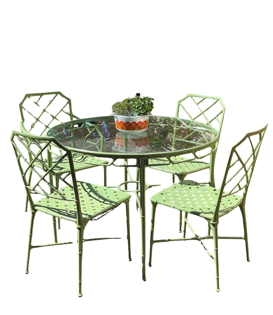 1950s Hall Bradley for Brown Jordan "Calcutta" 5-Piece Patio Dining Set: A vintage 1950s "Calcutta" patio dining set by Hall Bradley for Brown Jordan, attributed. This five-piece set is crafted from solid cast aluminum and includes a round dining table and four armchairs. 