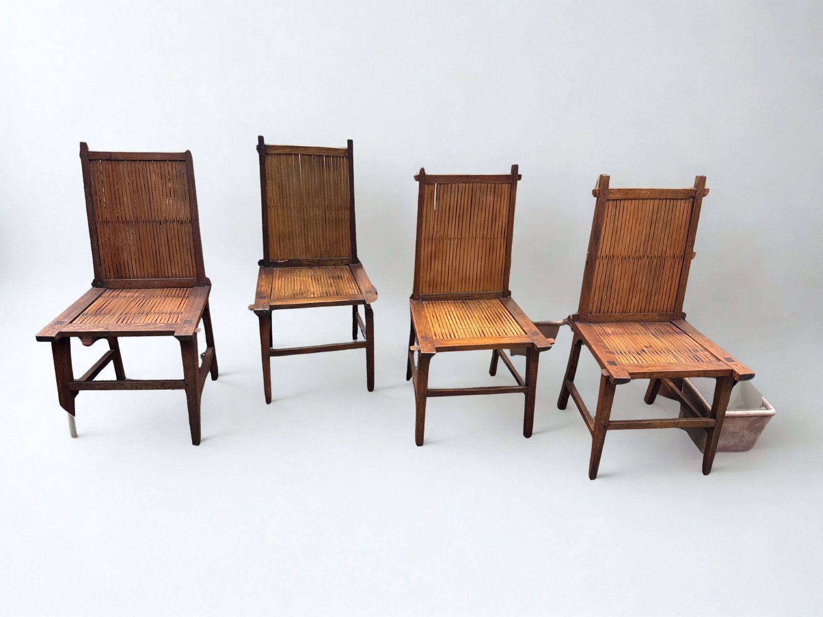 Set of Four Chinese Southern Official's Hat Armchairs, Nanguanmaoyi Style: These are old chairs and to a degree a bit primitive (they were not made for the Emperor). Some of the wood originally used has noticeable insect damage but those areas were intentionally turned