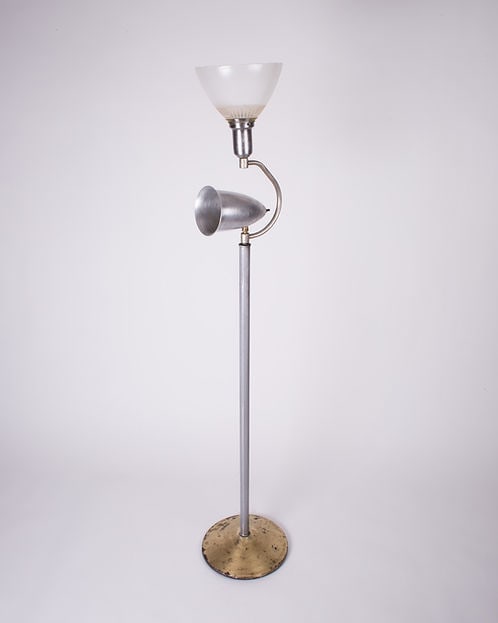 Early mid century Stilnovo Arteluce in the manner of: Interesting early mid century in the style of Stilnovo , odd and inusual shape .; Rewired with US Socket , some oxidation on the stripped metal .; H.58.5 in x Base 12 in with swiveling spot .