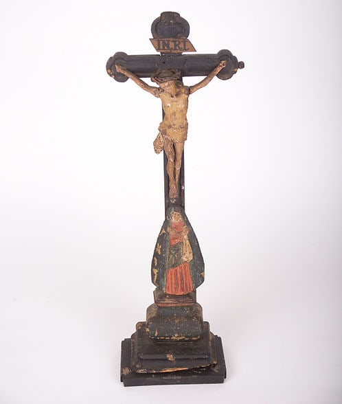 French early 18th Century Carved And Painted Wooden Crucifix: An early 18th Century antique hand carved and polychromed hand painted table crucifix from France with its original patina preserved. It depicts Christ on the cross with a crown of thorns with the Vir