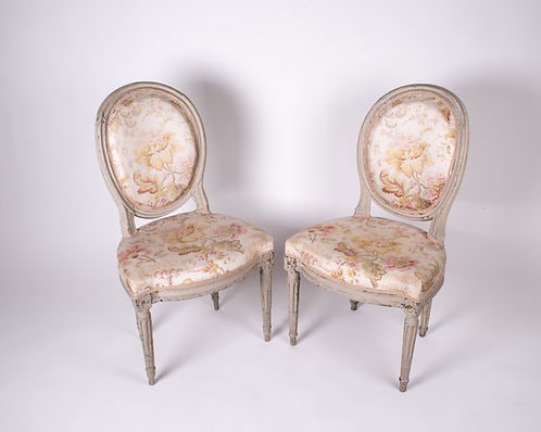 Louis XVI bedroom Chairs neo classic 18th: Charming 18th century bedroom chair in a sober and graceful style indicative of this era of political transition . The frame hand carved is painted with " grisaille " manner of the late 18th. The