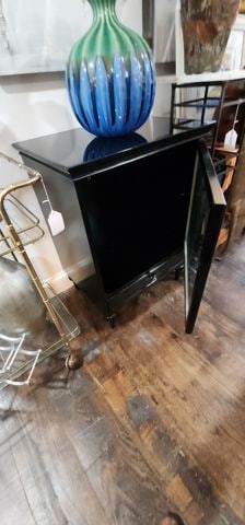 Modern designer deco-style black lacquer cabinet w/ pop-open glass door & bottom drawer. 24w x 18.5 - 3