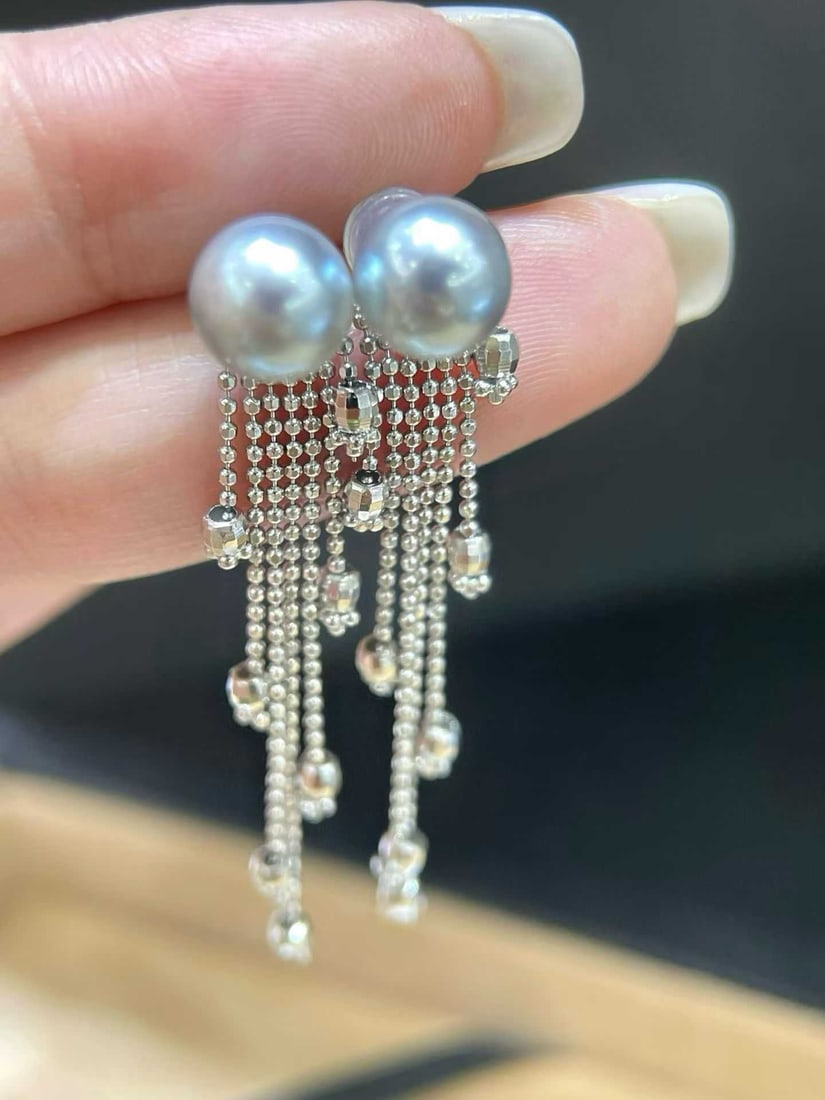 Sterling Silver Akoya Pearl Earrings 7-8mm: Title: Sterling Silver Akoya Pearl Earrings 7-8mm Description: These earrings are crafted from sterling silver with a cascading tassel design that adds movement. The 7-8mm pearls are lustrous and