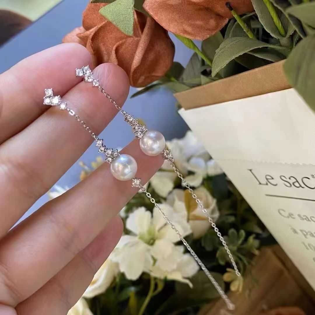 Sterling Silver Freshwater Pearl Earrings: Title: Sterling Silver Freshwater Pearl Earrings Description: These earrings are crafted from sterling silver and feature 8-9mm freshwater pearls, exuding an elegant aura. The perfectly round shape an
