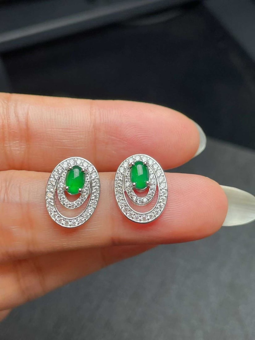 Silver Jadeite Earrings: Title: Silver Jadeite Earrings Description: These earrings feature jadeite as the main stone, showcasing a perfect blend of classic and modern. The design is simple yet elegant, suitable for various