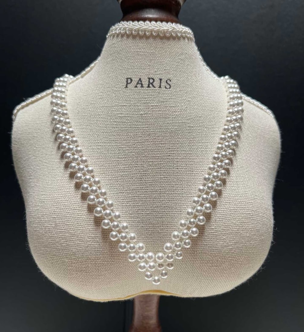Freshwater Pearl Necklace: Title: Freshwater Pearl Necklace Description: This necklace features 3.5-4mm freshwater pearls, showcasing an almost perfect round shape and strong luster. The unique V-shaped woven design elegantly