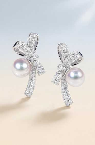 18K Gold Akoya Pearl Earrings: Title: 18K Gold Akoya Pearl Earrings Description: These earrings are crafted in 18K gold, featuring Akoya pearls with exceptional luster and minimal blemishes. The round pearls are beautifully