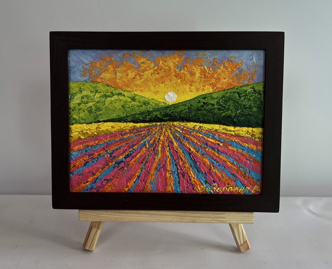 Oil painting Sunset over a flower field V. Zadorozhnya: NoAAA4578The painting "Sunset Over a Flower Field" is a mesmerizing oil painting on cardboard that captures the radiant beauty of the setting sun casting its golden glow over an expansive field of flo