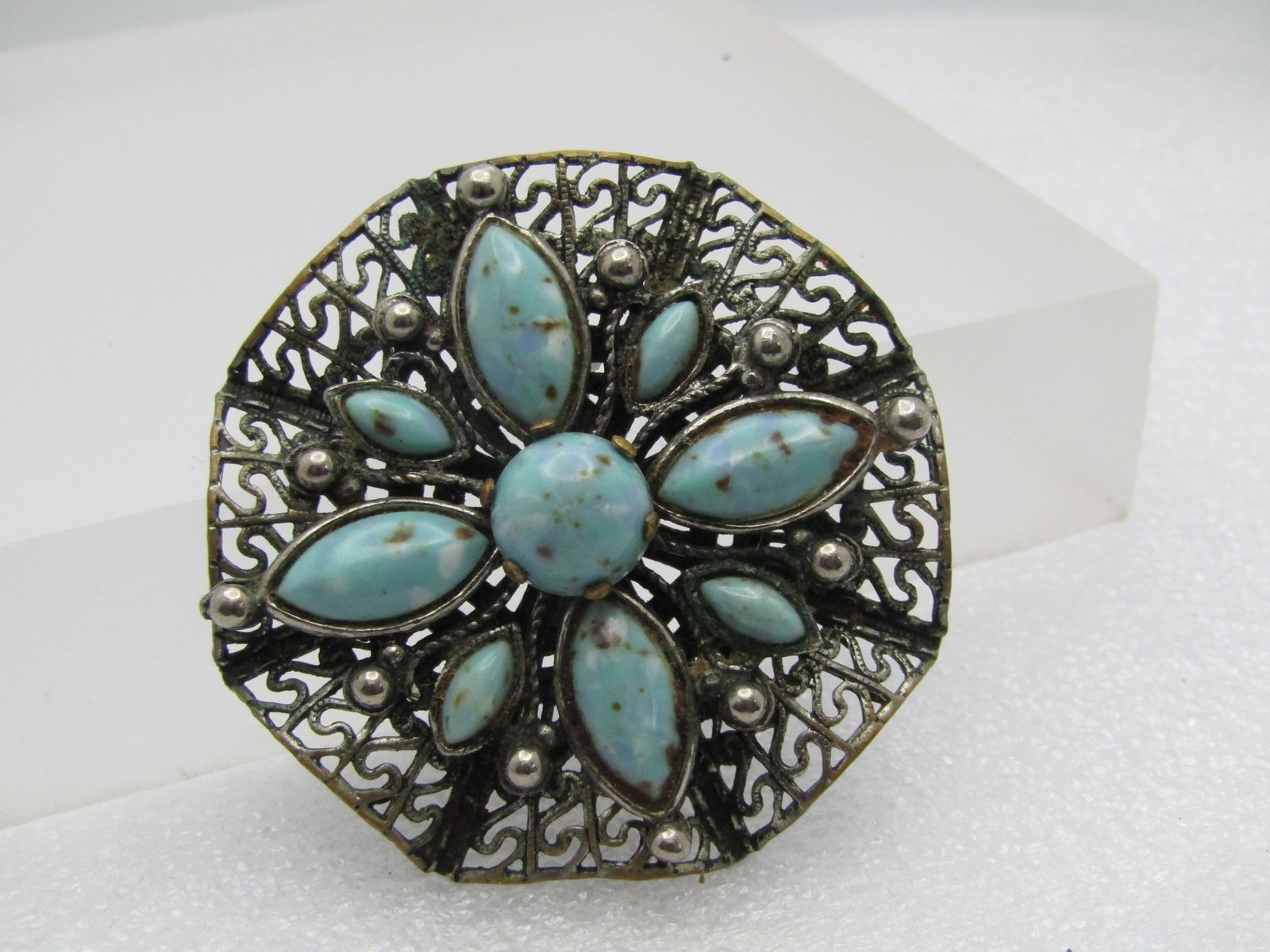 Vintage Filigree Turquoise Glass Brooch, 1960's-1970's. 2": Title: Vintage Filigree Turquoise Glass Brooch, 1960's-1970's. 2" Description: Vintage Filigree Turquoise Glass Brooch, 1960's-1970's. 2". The stones are a domed turquoise glass that are cateye shaped