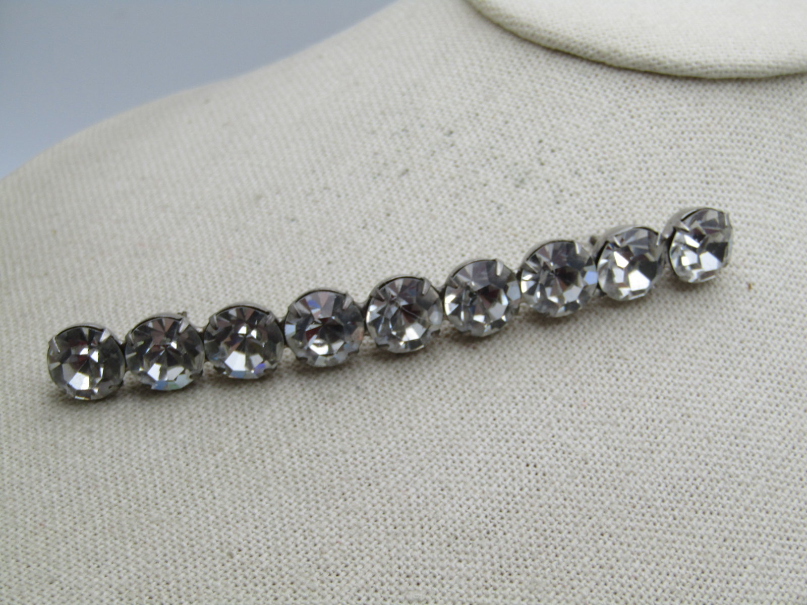 Vintage Clear Rhinestone Bar Brooch, 4", Mid-Century: Title: Vintage Clear Rhinestone Bar Brooch, 4", Mid-Century Description: Vintage Clear Rhinestone Bar Brooch, 4", Mid-Century. Estimated 1940's-1960's. The clear rhinestones are set in a cupped bar wi