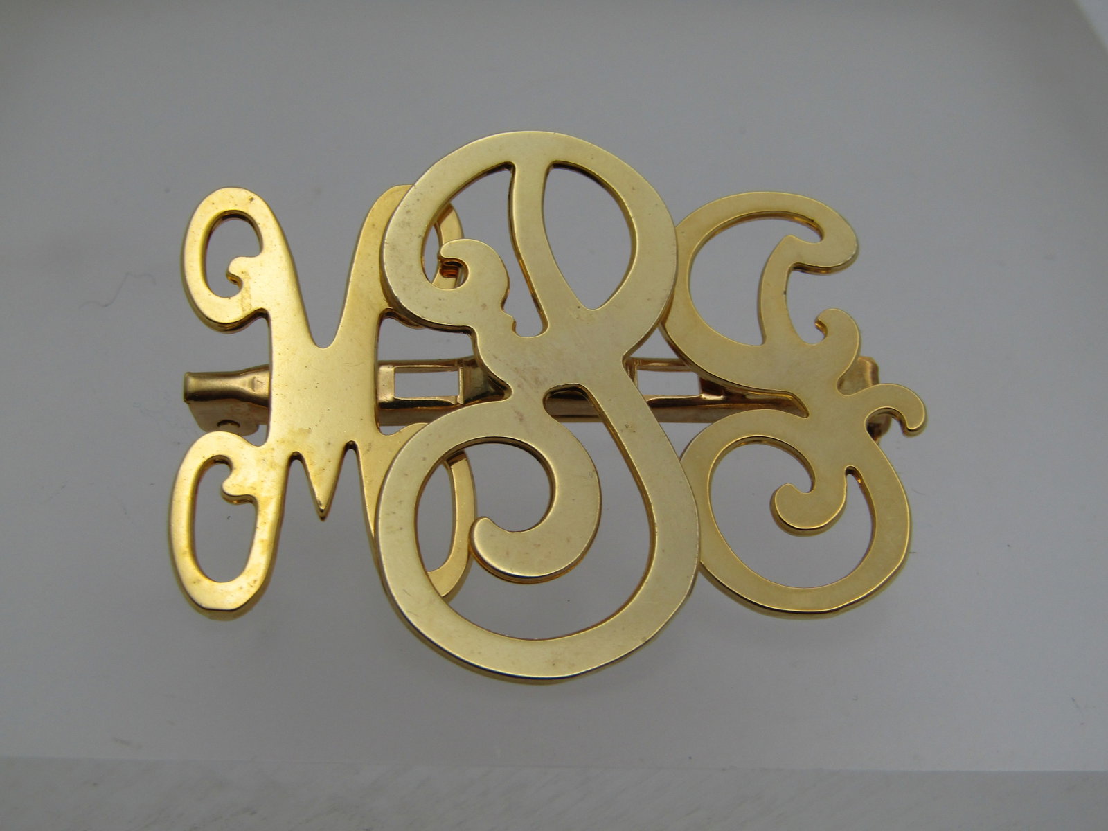 Vintage MPJ Monogrammed Brooch, Gold Tone, 1970's: Title: Vintage MPJ Monogrammed Brooch, Gold Tone, 1970's Description: Vintage MPJ Monogrammed Brooch, Gold Tone, 1970's. 1.5" at center, 1.25" for the letters on the ends. The P in the center is sligh
