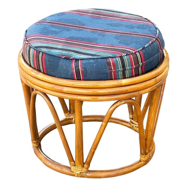 1950s Restored Rattan Footstool With Striped Jacquard Navy Cushion: Title: 1950s Restored Rattan Footstool With Striped Jacquard Navy Cushion Description: Vintage rattan stool featuring a circular bentwood frame with natural honey patina and arched supports for added