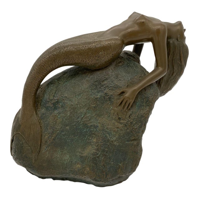 1980s Bronze Mermaid Siren Statue on Beach Rock by James Siebert: Title: 1980s Bronze Mermaid Siren Statue on Beach Rock by James Siebert Description: siren mermaid statue on beach Rock featuring a young seductive mermaid singing here her song, back arched to