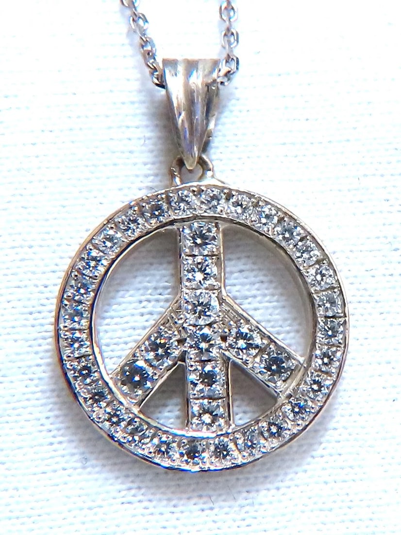 .80ct Bead Set Peace Charm natural Diamond Necklace 14kt**: Title: .80ct Bead Set Peace Charm natural Diamond Necklace 14kt** Description: Loves & Sparkles. .80ct. Natural diamonds Peace necklace. Full cut and Brilliant G-color, Vs-2 clarity Pendant Measuremen