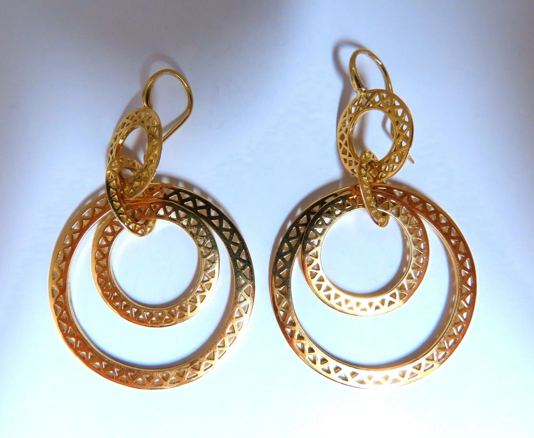 Circular Rolling Rings Dangle Earrings 18kt gold**: Title: Circular Rolling Rings Dangle Earrings 18kt gold** Description: Rotating Circlular Dangle Earrings Criss Cut Triangles Mesh Pattern Larger Diameter Circle: 33mm Mid Diameter Circle: 21mm