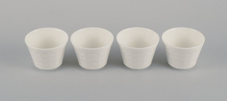 Wilhelm Kåge for Gustavsberg. Four flower pot covers in porcelain. Swedish design, 1960s. - 2