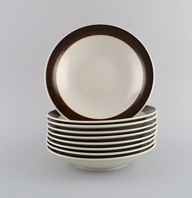 Hertha Bengtson (1917-1993) for Rörstrand. Nine Koka deep plates in glazed stoneware. 1960s. - 2