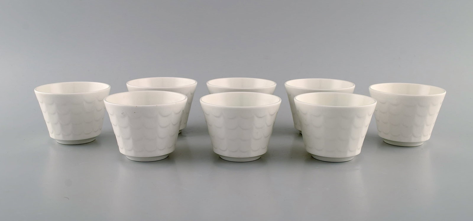 Wilhelm Kåge for Gustavsberg. Eight herb pots in white glazed porcelain. Swedish design, 1960s. - 2