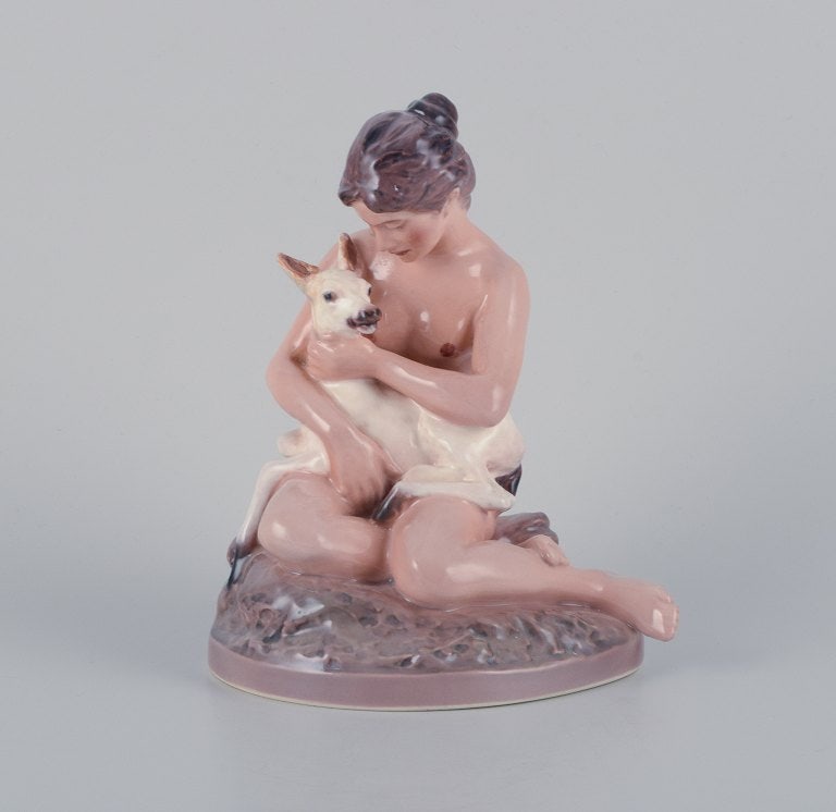 Dahl Jensen porcelain figurine, girl with fawn.: Dahl Jensen porcelain figurine, girl with fawn. No. 1276. First factory quality. Marked. In excellent condition. Dimensions: H 17.5 cm x L 13.5 cm x W 11.0 cm. Reserve: $392.00 Shipping: Domestic: