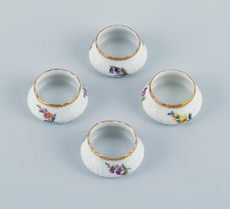 Royal Copenhagen, Saxon Flower. A set of four salt jars, hand painted with flowers and gold edge.: Royal Copenhagen, Saxon Flower. A set of four salt jars, hand painted with flowers and gold edge. 1890s. Model number 4/1708. Marked. In perfect condition. First factory quality. Dimensions: D 4.5 x