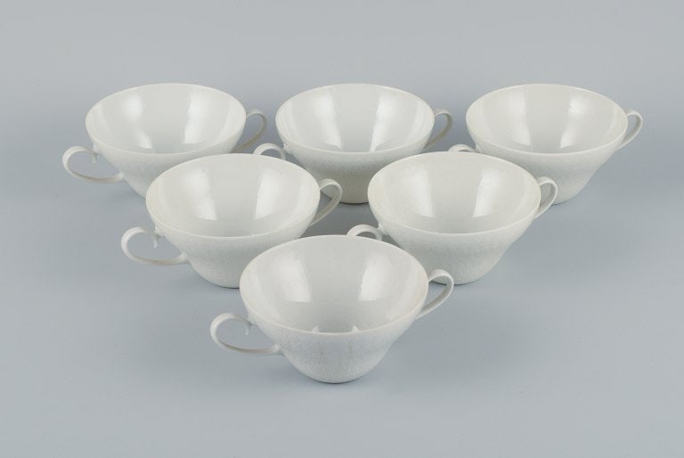 Bjørn Wiinblad for Rosenthal, a six of four bouillon cups.: Bjørn Wiinblad for Rosenthal, a six of four bouillon cups. 1980s. In perfect condition. Marked. Dimensions: D 11.8 (without handle) x H 6.5 cm. Reserve: $336.00 Shipping: Domestic: Shipping