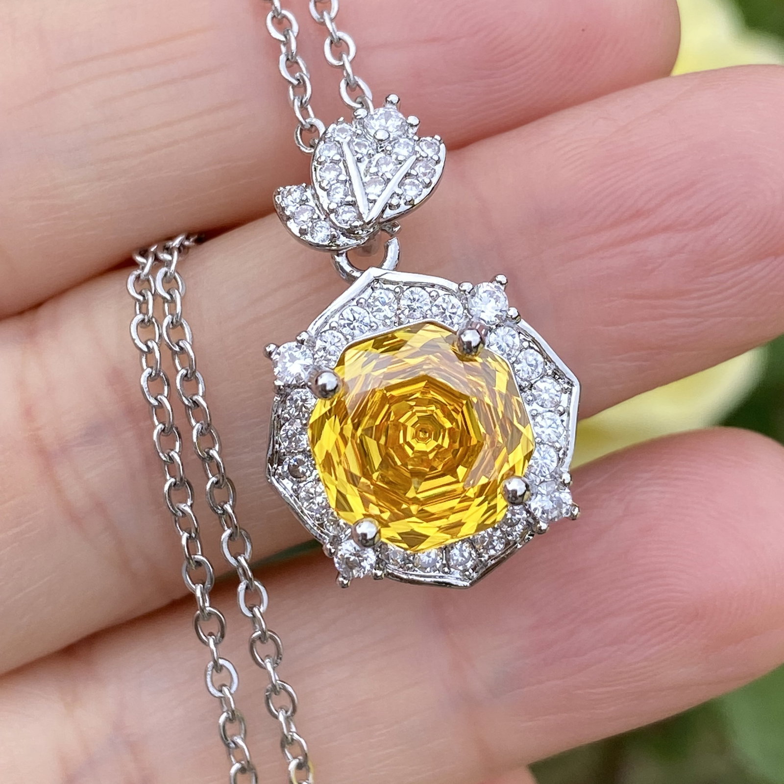 18K White Gold Plated Radiant-Cut Yellow Sapphire and Moissanite Halo Pendant Necklace: Title: 18K White Gold Plated Radiant-Cut Yellow Sapphire and Moissanite Halo Pendant Necklace Description:An elegant radiant-cut yellow sapphire pendant necklace, beautifully surrounded by a halo of b