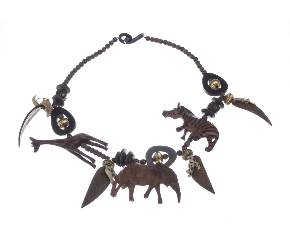 African Wood Safari Bead Charm Necklace: Title:African Wood Safari Bead Charm Necklace Description:Extremely original necklace, made of wood and hand carved in Kenya. Circa, 1970’s. Necklace measures 26” long. Giraffe, zebra and