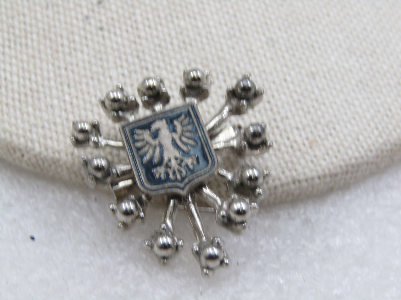 Vintage Enameled Bird Crest/Flag Brooch, Enameled, 1970's: Title: Vintage Enameled Bird Crest/Flag Brooch, Enameled, 1970's Description: Vintage Enamealed Eagle Crest/Flag Brooch, 1960's-1970's. This has ray-like stems coming from behind the shield that each 