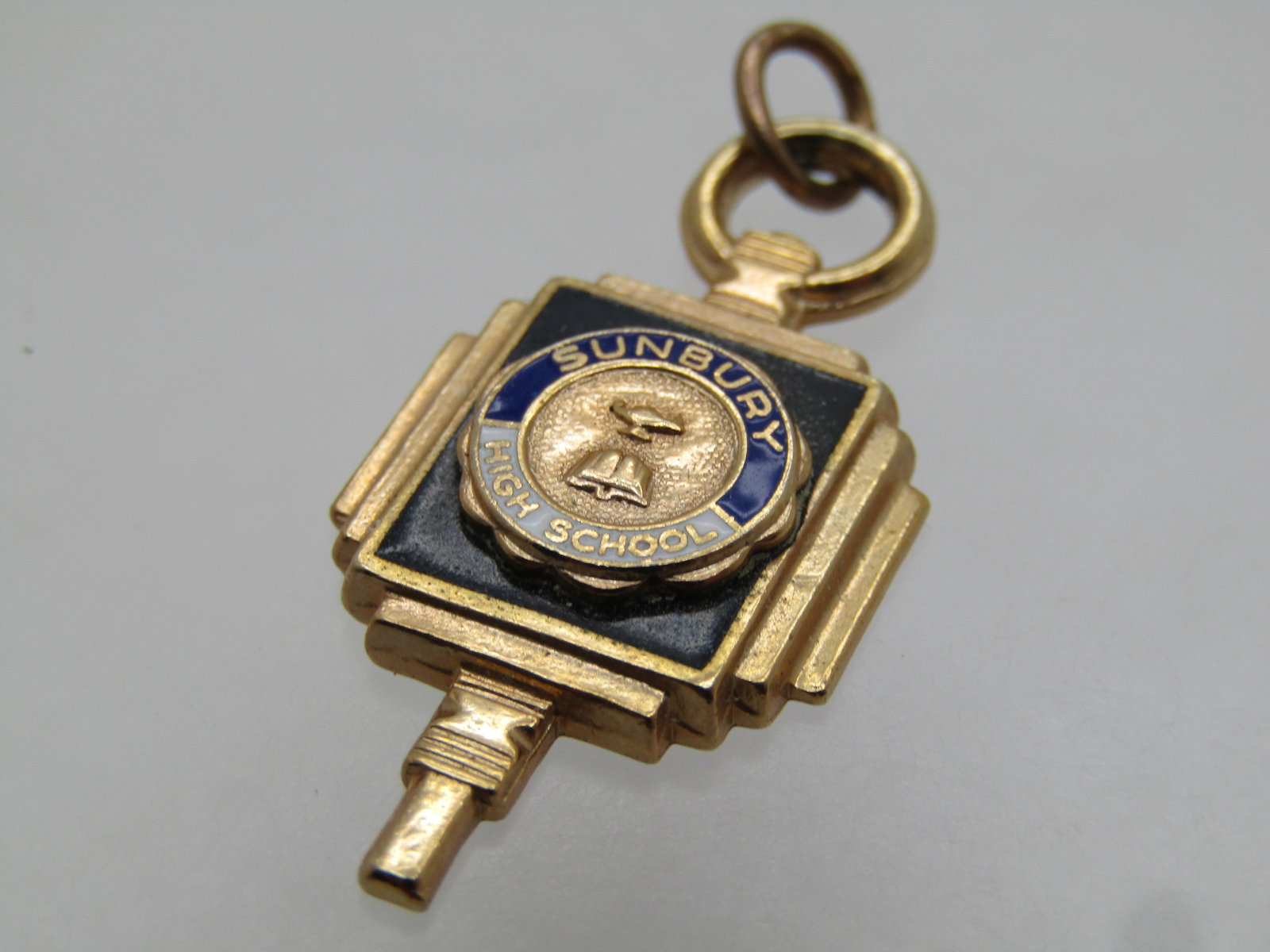 Vintage Sunbury High School Fob/Charm, 10kt G.F., 1960's-1970's: Title: Vintage Sunbury High School Fob/Charm, 10kt G.F., 1960's-1970's Description: Vintage Sunbury High School Fob/Charm/Pendant, 10kt G.F., 1960's-1970's is the estimted age. Black background with b