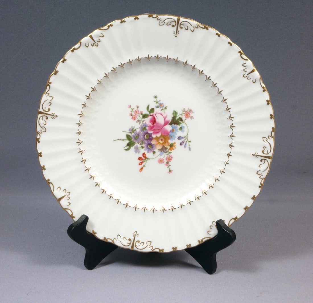 Royal Crown Derby ASHBY Posies Dinner Plate England Vintage: This is a beautiful Dinner Plate. The plate is from ASHBY Pattern with Posies center by Royal Crown Derby. The pieces are enhanced with gold scrolls at the rim. The plate has Posies floral center The 