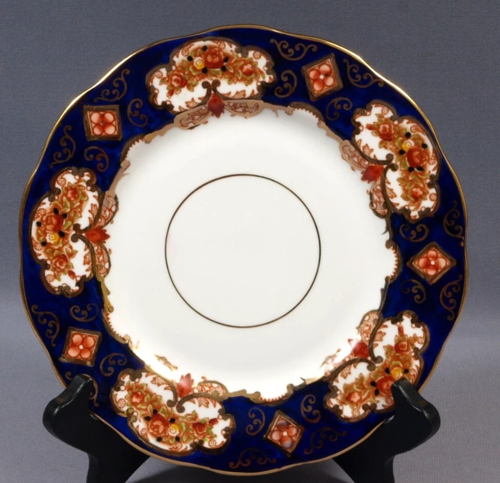 Royal Albert Crown China Heirloom IMARI Luncheon Plate COBALT Blue 8 1/8": This is a beautiful and timeless Luncheon/Salad Plate in a Heirloom Pattern, made made by Royal Albert in England. The pattern is a lovely cobalt blue, rust and ivory Imari style pattern with a gold h