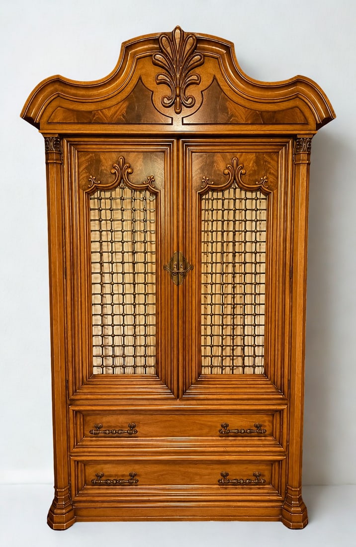 Carved Baroque Style Armoire/Wardrobe: A large, ornate Baroque-style armoire or wardrobe, likely from the late 20th century, constructed from warmly toned wood, possibly walnut or a similar hardwood, with decorative veneer accents. The pie