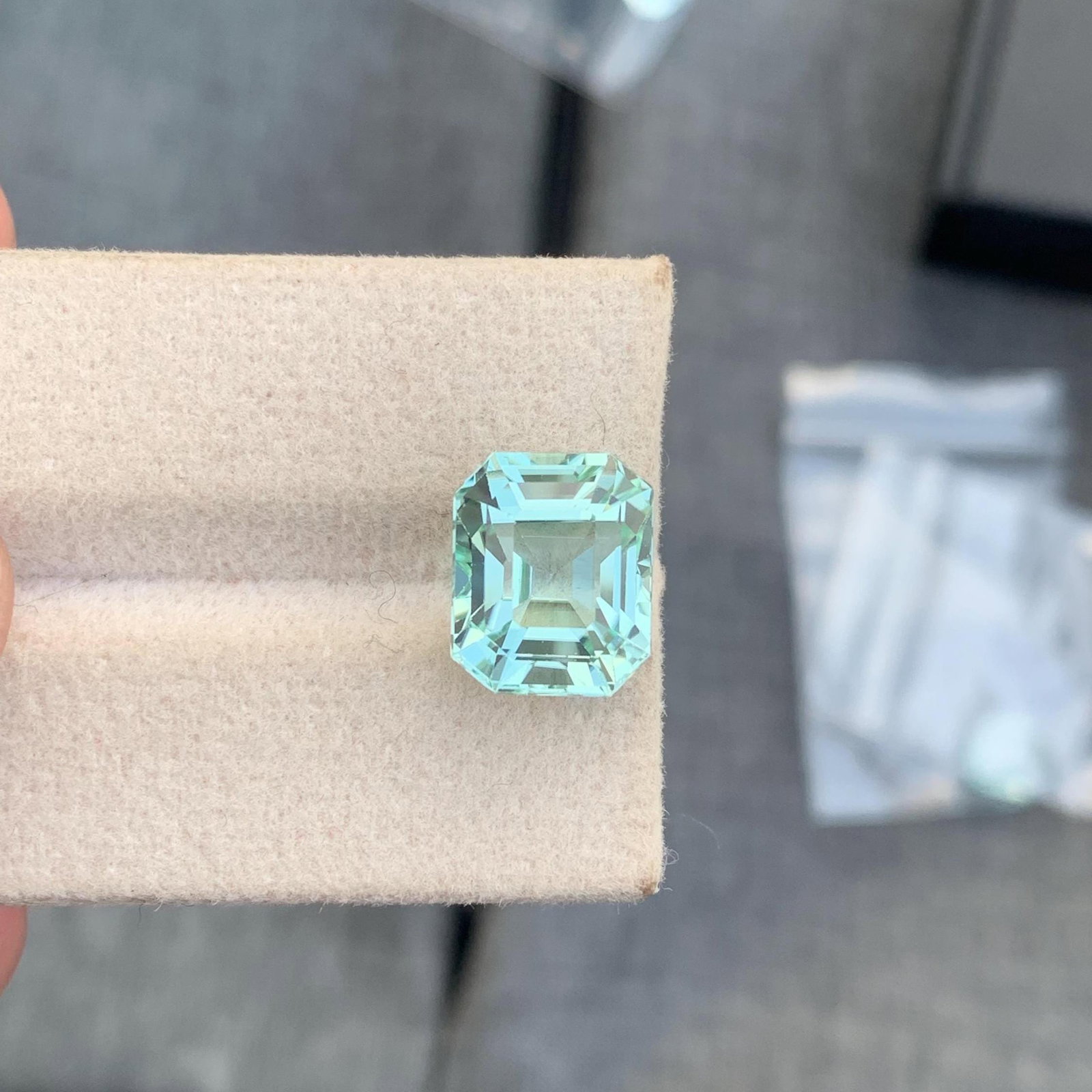 Seafoam Tourmaline Gemstone: 7.20 Carat Asscher Cut Stone: Tourmaline Details: * Weight : 7.20 carat * Dimension : 11.9*9.8*8.1 mm * Shape : Long Asscher * Colour : Seafoam * Origin : Afghanistan * Lustre: Vitreous * Certificate : On Customer Demand * SKU : G