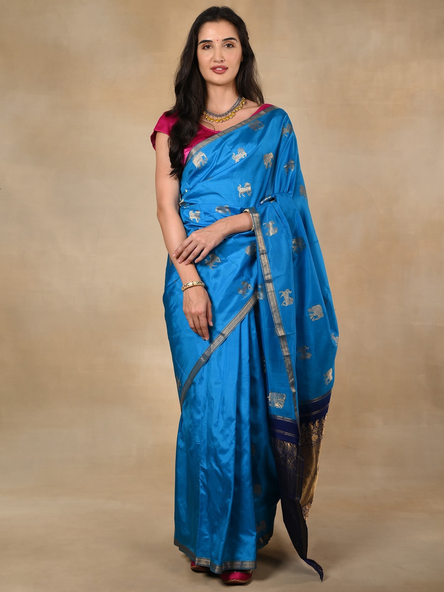 Royal Blue Pure Silk Banarasi Saree with Zari Border Traditional Motifs: Title:Royal Blue Pure Silk Banarasi Saree with Zari Border Traditional Motifs Description:Royal blue- the color of regalia, is the perfect choice for this pure silk Banarasi saree, which is adorned