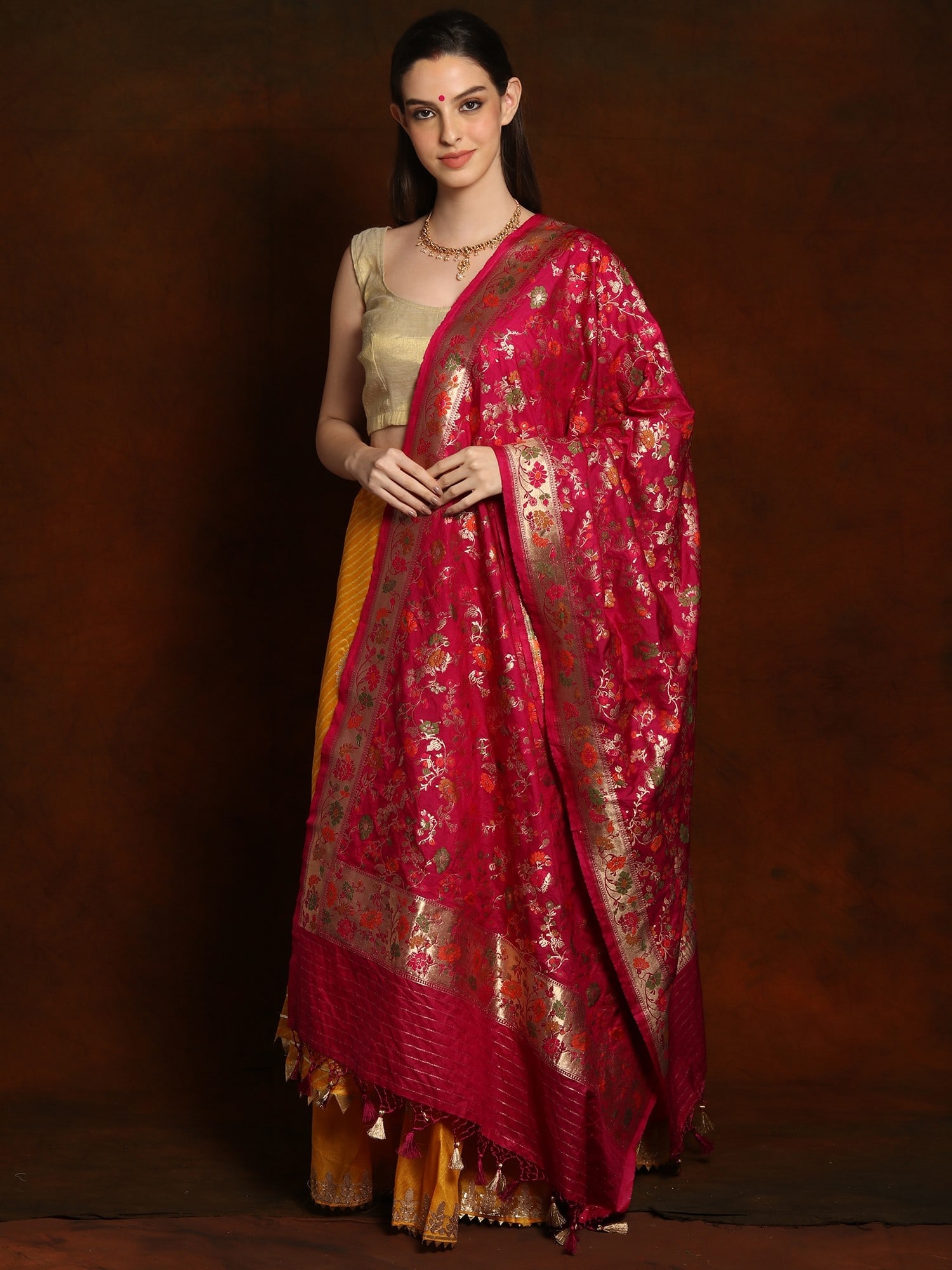 Royal Banarasi Brocade Silk Dupatta with Striped Palla and Tassels: Title:Royal Banarasi Brocade Silk Dupatta with Striped Palla and Tassels Description:Having a Banarasi dupatta is like having the key to getting your festive fashion right every time. This royal